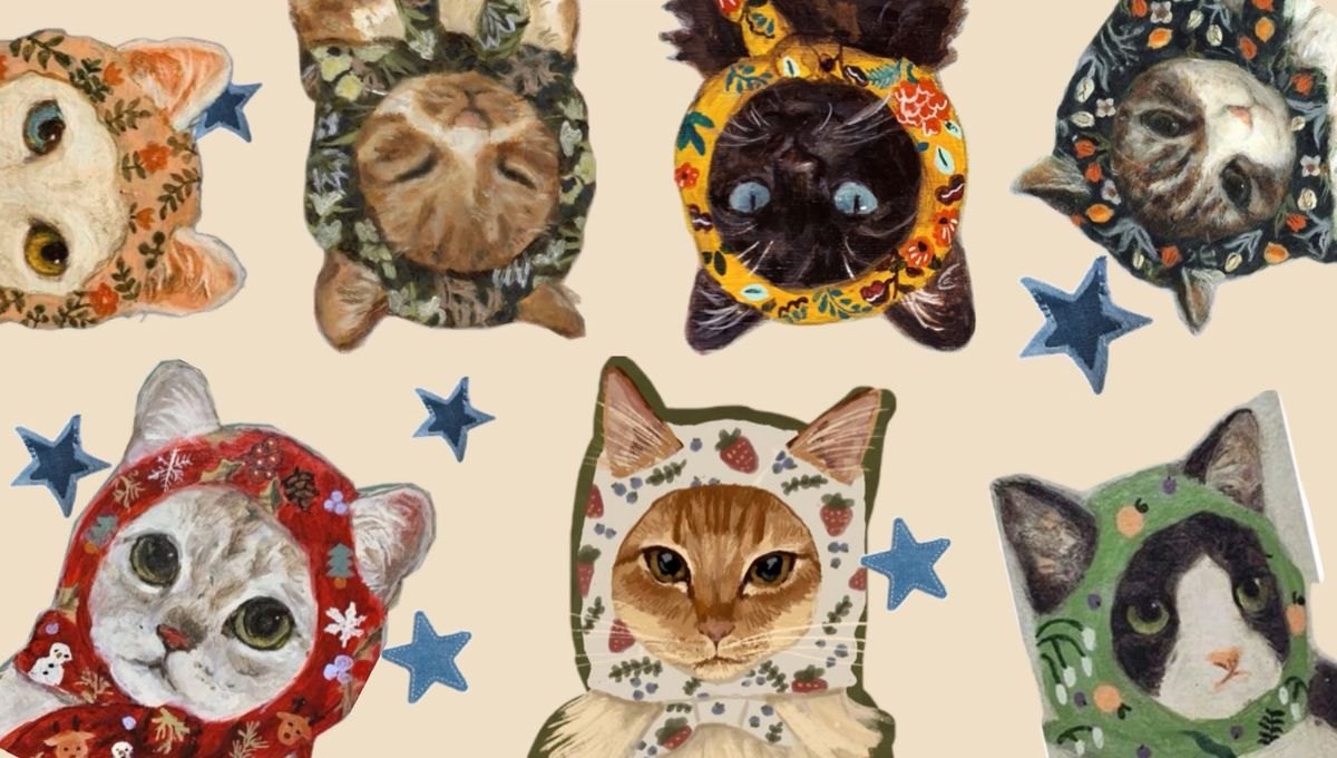Painted cats wearing hoods in different floral patterns, scattered with blue stars on a cream background.